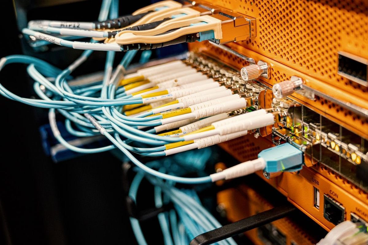 Fiber and network cables plugged into server equipment