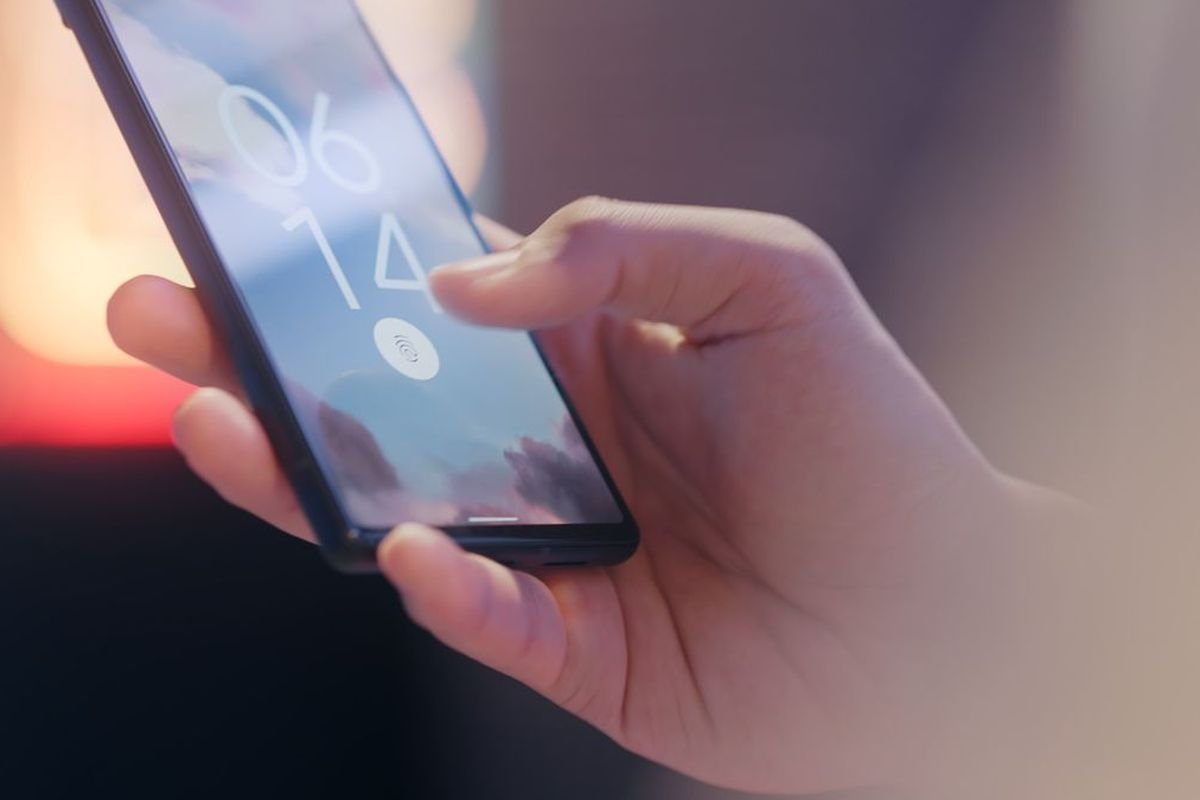 Person holding a smartphone in one hand