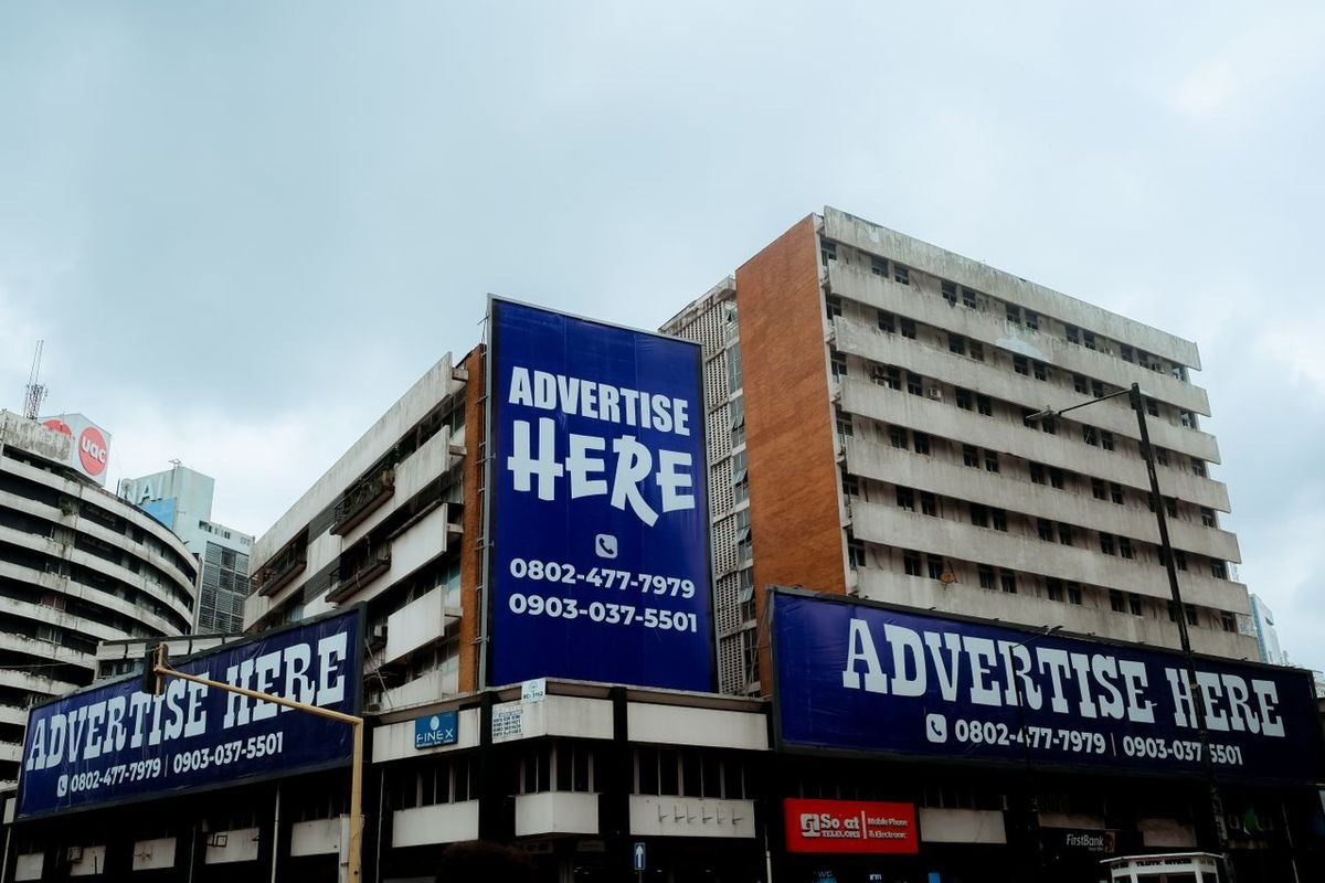 Buildings covered in large advertising billboards