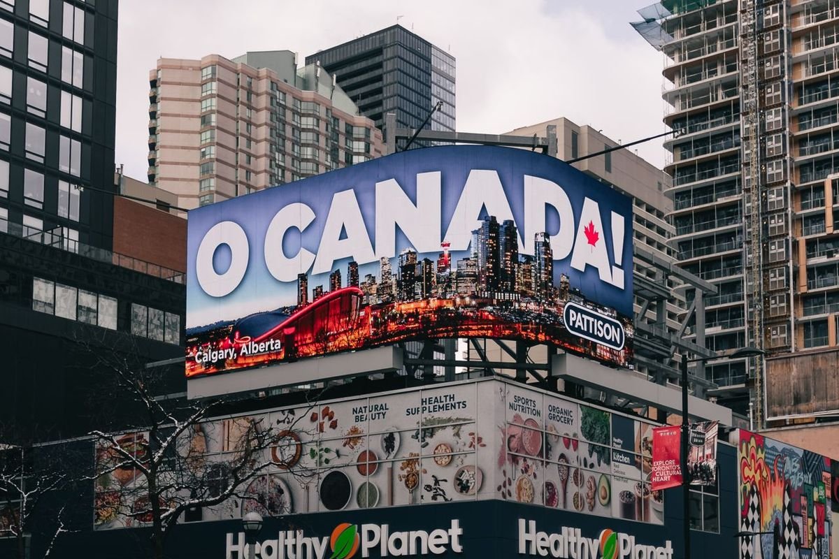 Large billboard above a busy city street
