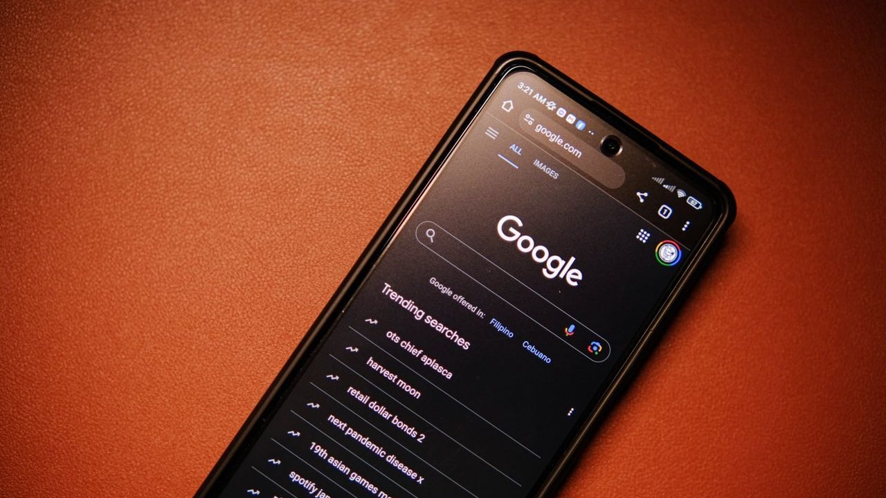 Smartphone showing a Google search on a table