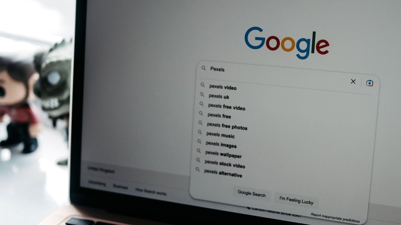 Laptop screen showing Google search suggestions